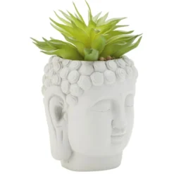 Tête Bouddha avec plante